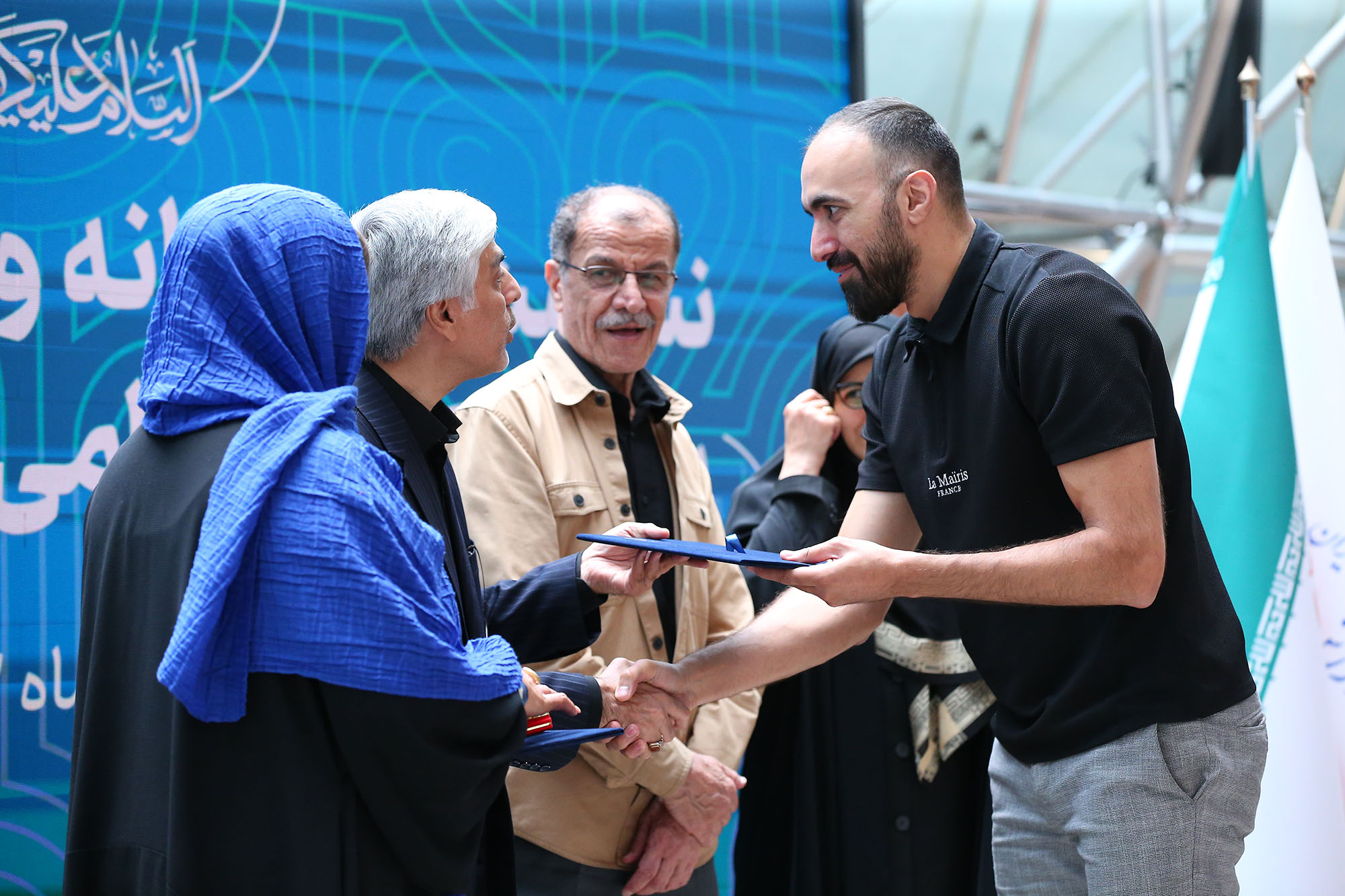 مراسم بدرقه کاروان ورزشی اعزامی به بازی های المپیک پاریس و امضا تفاهم نامه ورزشی با آستان قدس رضوی 11